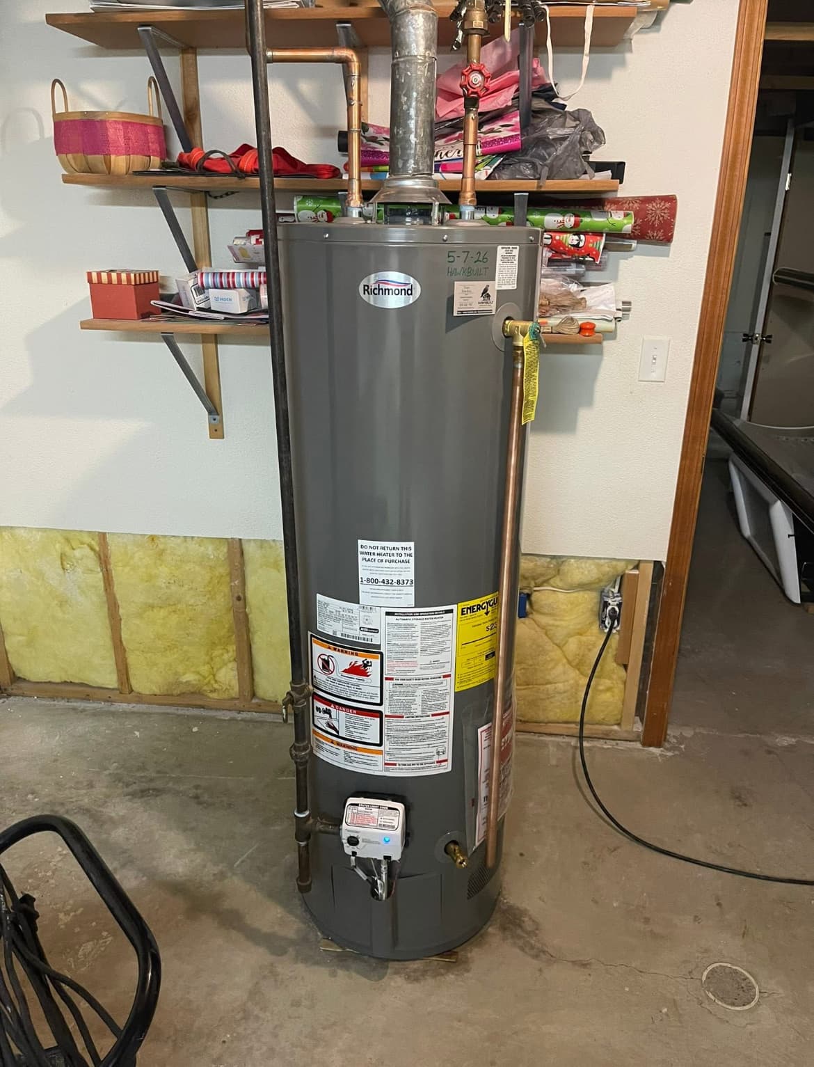 Richmond natural gas tank water heater with proper venting in a Leawood-area garage installation